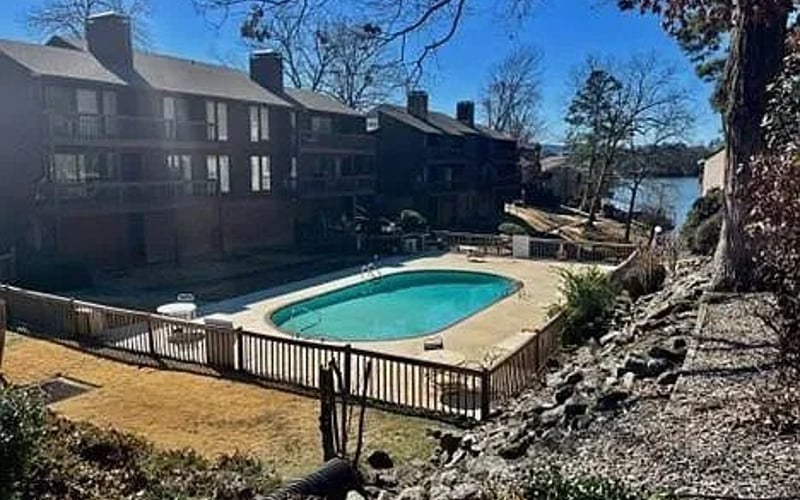 Community pool with lake view