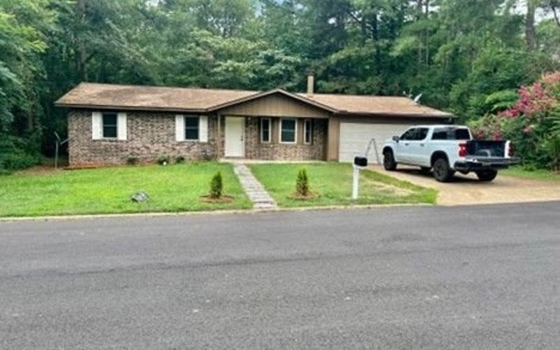 Front exterior from street with truck in driveway