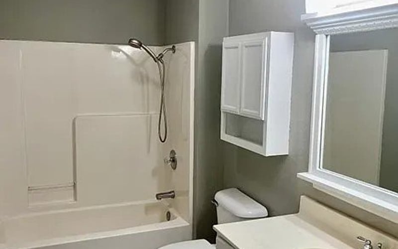 Bathroom with tub, shower, and vanity
