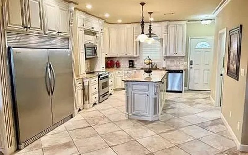 Kitchen with island and stainless appliances