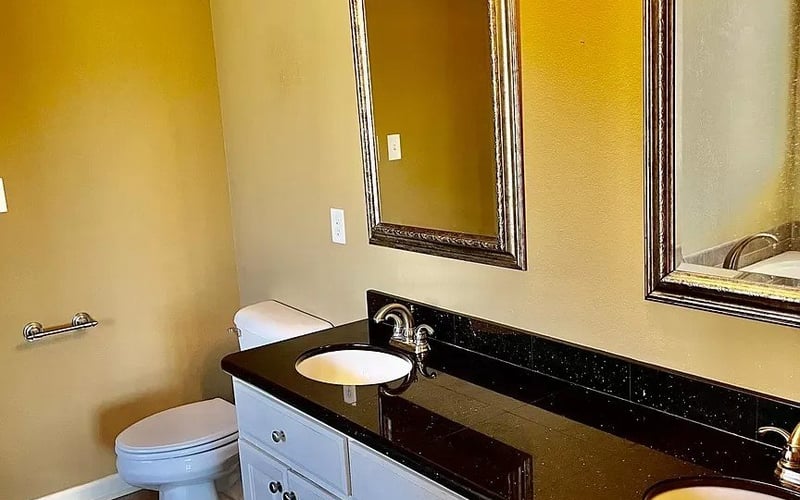 Double vanity with black granite countertop