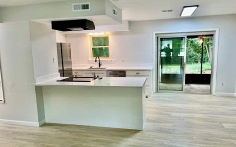 Kitchen with white cabinets and island