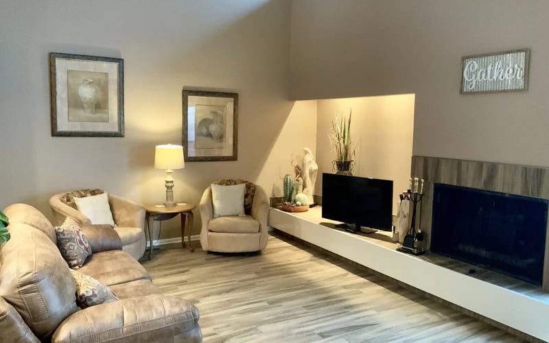 Living room with vaulted ceiling and TV