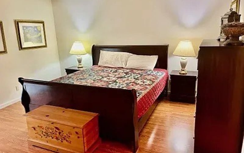 Primary bedroom with hardwood floors
