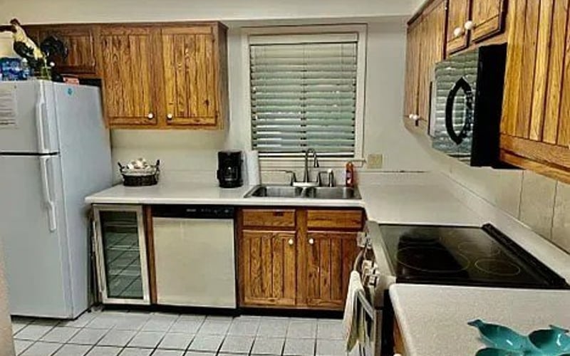 Kitchen with wine cooler and dishwasher