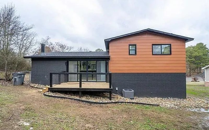 Rear exterior with deck and cedar siding