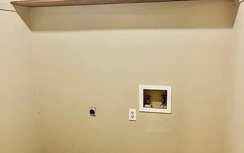 Laundry room with washer hookup and wood flooring