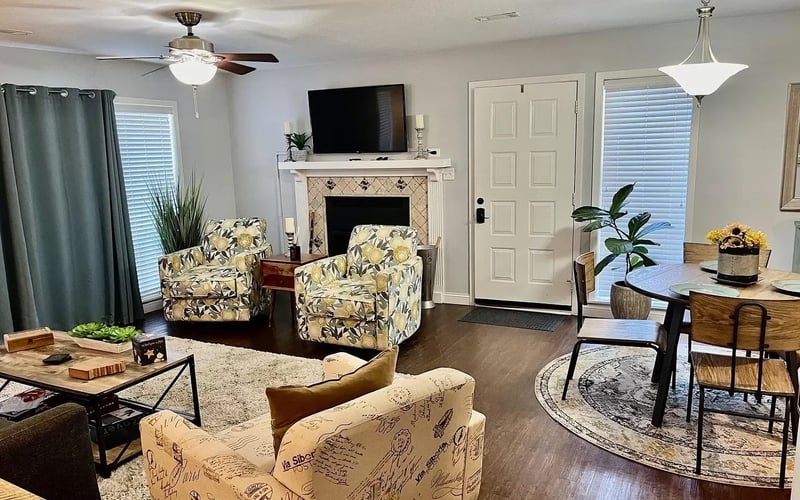 Living room with fireplace and dining area