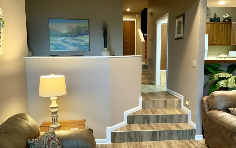 Interior staircase with kitchen view