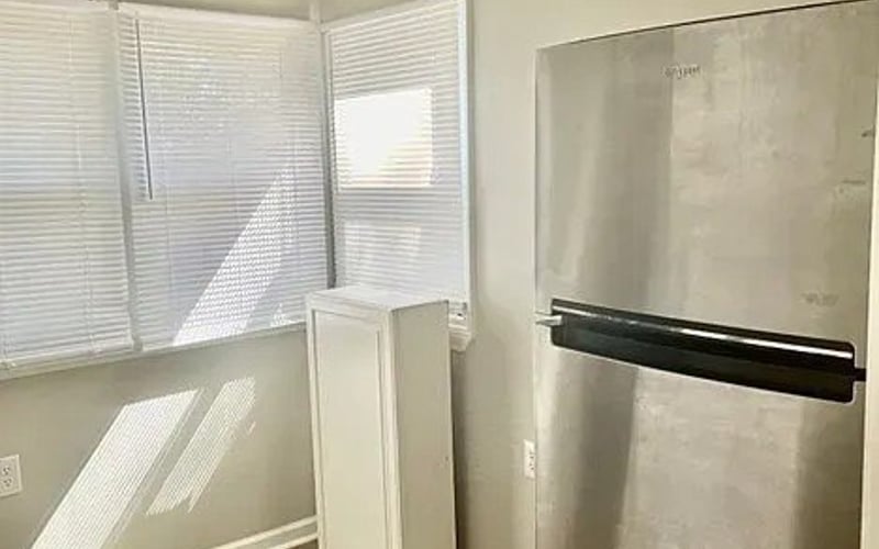 Kitchen with refrigerator