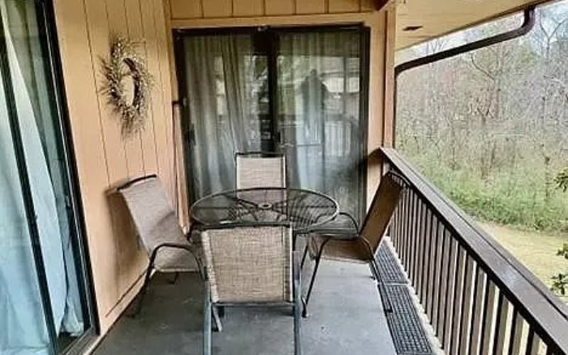 Balcony with patio table and chairs
