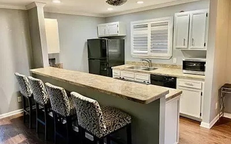Kitchen with island and bar seating