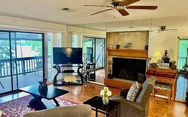 Living room with fireplace and lake views