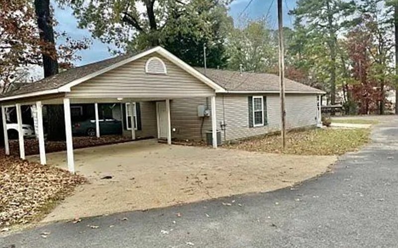 Front exterior with carport and driveway