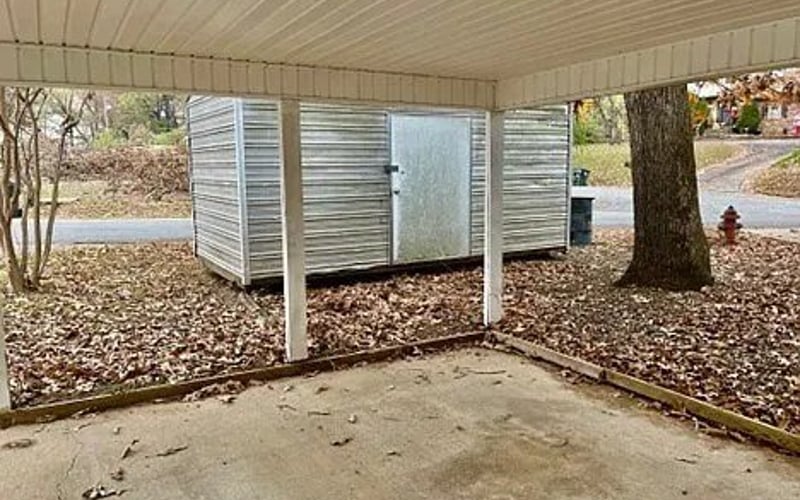 Covered carport with storage shed