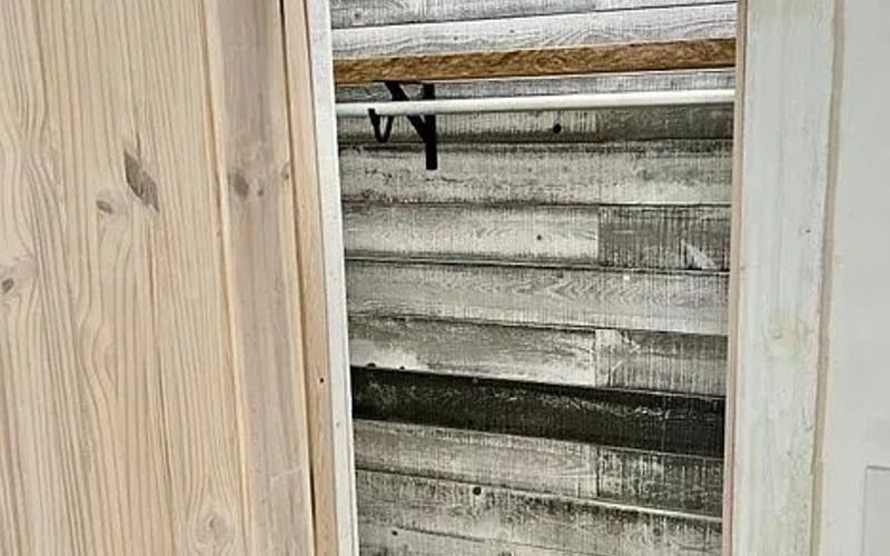 Closet with reclaimed wood wall