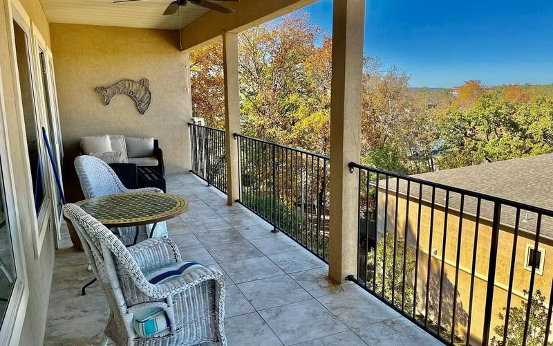 Covered balcony with fall foliage seating area