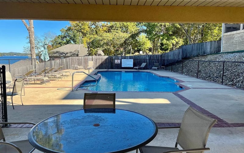 Community pool with lake view