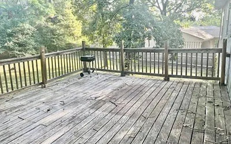 Deck with grill and tree views