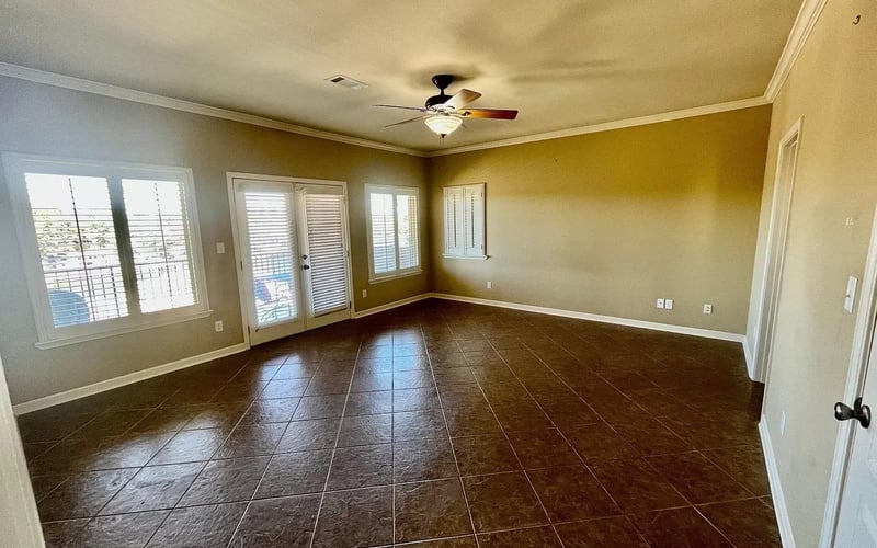 Master bedroom with French doors to balcony