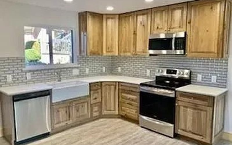 Kitchen with wood cabinets and subway tile