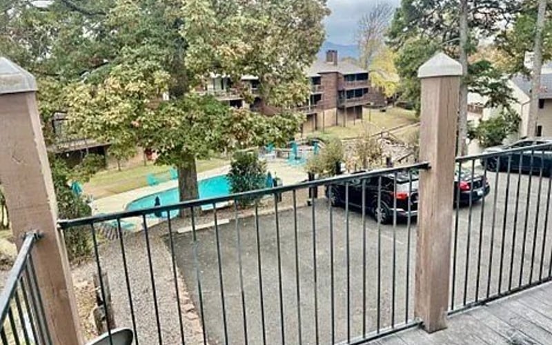 Balcony view overlooking pool and complex