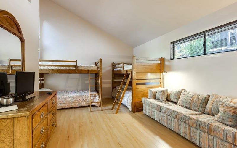 Bunk bedroom with sofa