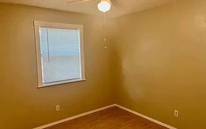 Bedroom with window and ceiling fan