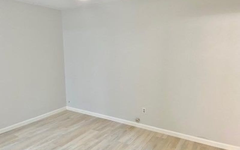 Bedroom with ceiling fan and hardwood floors