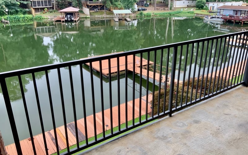 Balcony view of private boat dock and lake