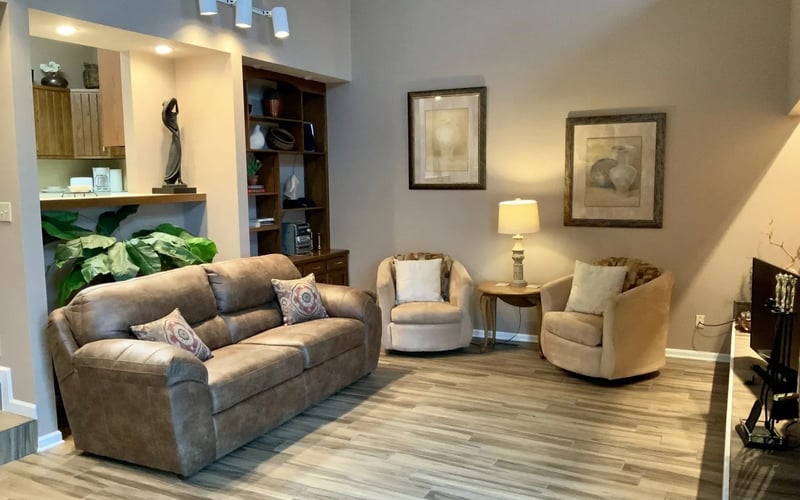 Living room with sofa and swivel chairs