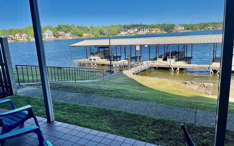 Patio with boat dock and lake view