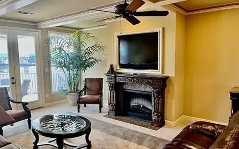 Living room with fireplace and TV