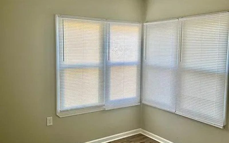 Bedroom with corner windows